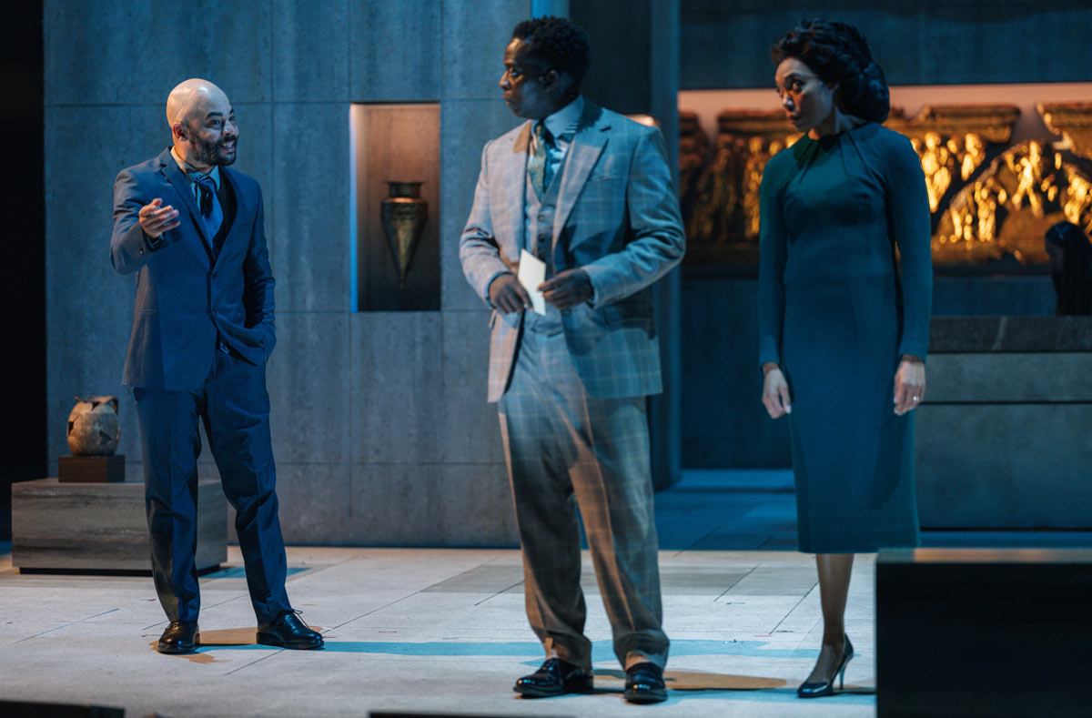 Ashley Gerlach (Flaminius), Kobna Holdbrook-Smith (Aufidius), and Chereen Buckley (Andromeda) in Coriolanus at the National Theatre. Photo Misan Harriman.