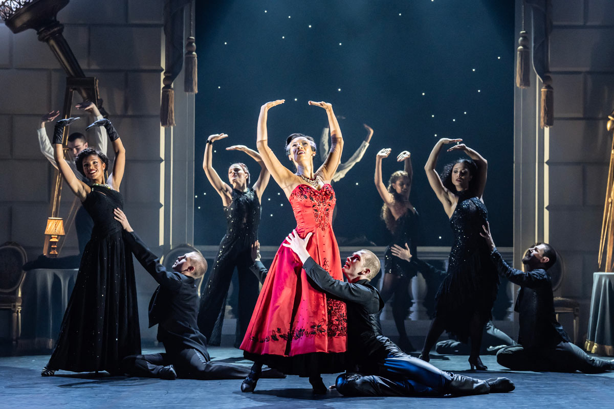 MATTHEW BOURNE'S SWAN LAKE. Nicole Kabera (The Queen) and Company. Photo Johan Persson.