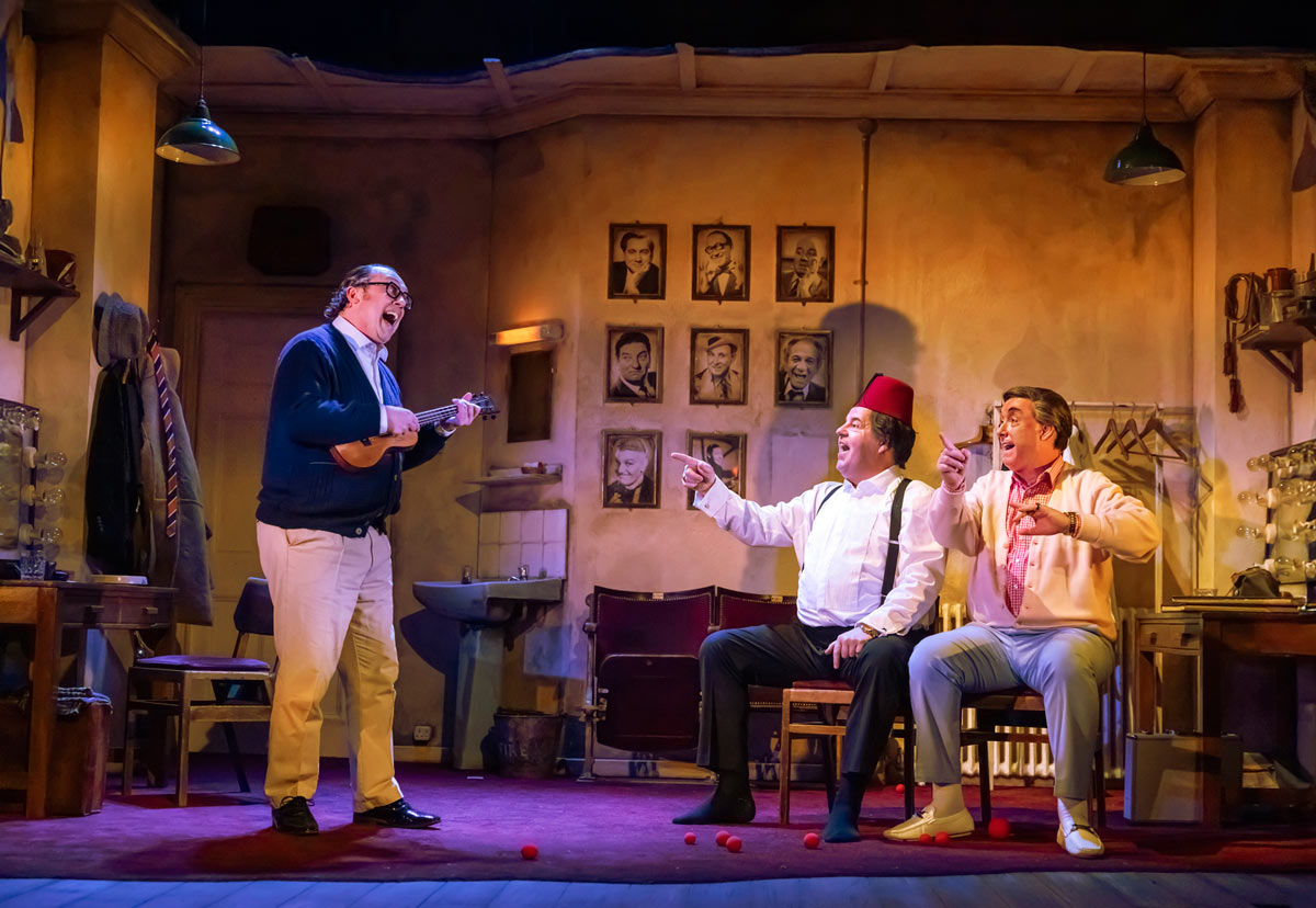 THE LAST LAUGH at Noël Coward Theatre. Bob Golding (Eric Morecambe), Damian Williams (Tommy Cooper) and Simon Cartwright (Bob Monkhouse). Photo Pamela Raith